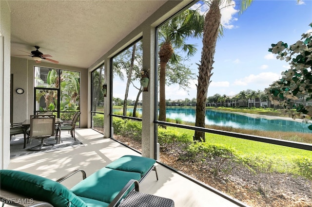 9224 Campanile Cir Unit 103, Naples, FL 34114 - sunroom featuring a water view and a ceiling fan
