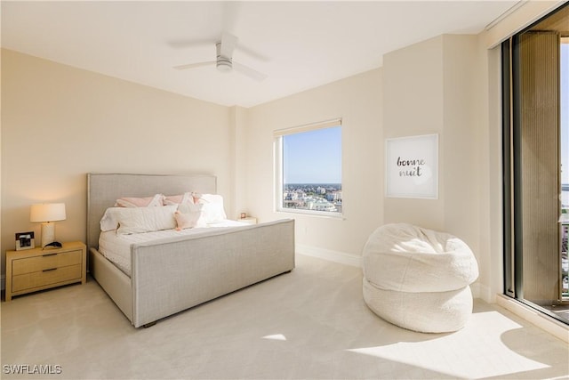 940 Cape Marco Dr Unit 1703, Marco Island, FL 34145 - bedroom featuring light carpet, baseboards, and a ceiling fan