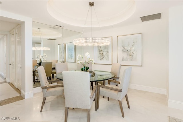 940 Cape Marco Dr Unit 1703, Marco Island, FL 34145 - dining area featuring a tray ceiling, a chandelier, and baseboards