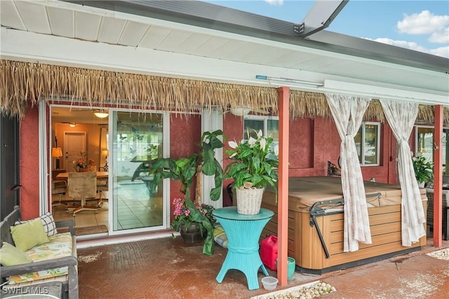 view of patio with a hot tub