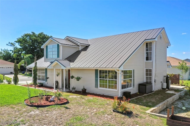 8151 New Jersey Blvd, Fort Myers, FL 33967 - traditional home with metal roof and a front yard