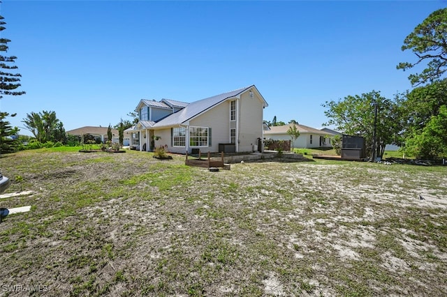 8151 New Jersey Blvd, Fort Myers, FL 33967 - rear view of property featuring metal roof