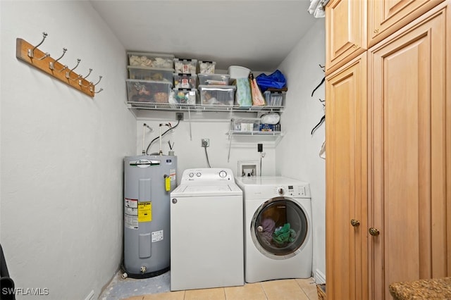 8151 New Jersey Blvd, Fort Myers, FL 33967 - washroom featuring water heater, washing machine and clothes dryer, cabinet space, and light tile patterned floors