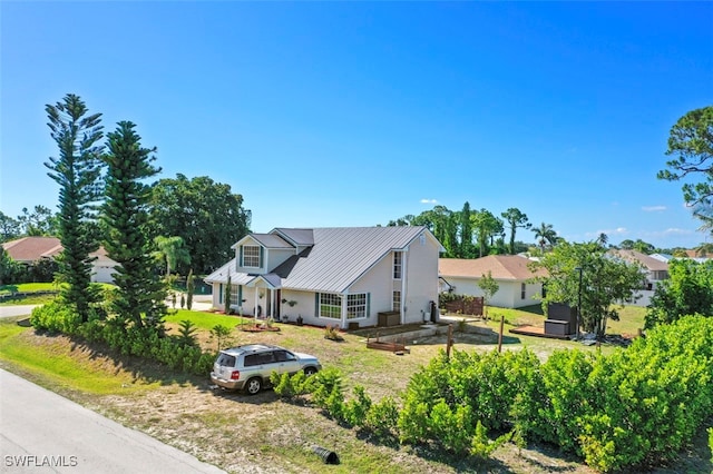 8151 New Jersey Blvd, Fort Myers, FL 33967 - view of front of house featuring metal roof