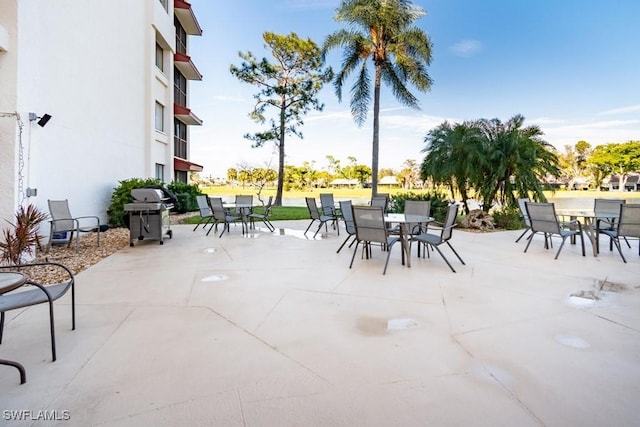 view of patio / terrace with outdoor dining space and a grill