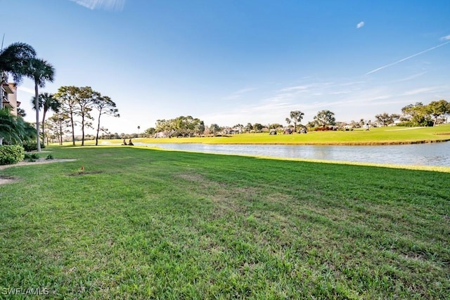 view of grassy yard with a water view