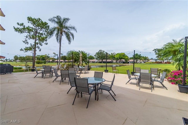 7410 Lake Breeze Dr Unit 204, Fort Myers, FL 33907 - view of patio with outdoor dining space and area for grilling