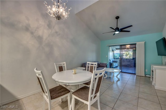 3914 SW 8th Ct Unit 103, Cape Coral, FL 33914 - dining space with vaulted ceiling, ceiling fan, light tile patterned flooring, a chandelier, and baseboards