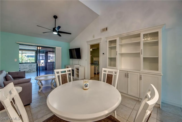 3914 SW 8th Ct Unit 103, Cape Coral, FL 33914 - dining space featuring ceiling fan, vaulted ceiling, light tile patterned floors, and baseboards