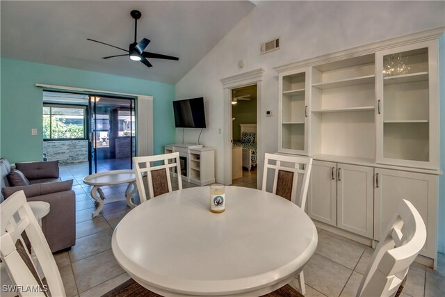 3914 SW 8th Ct Unit 103, Cape Coral, FL 33914 - dining space featuring vaulted ceiling, a ceiling fan, and light tile patterned floors