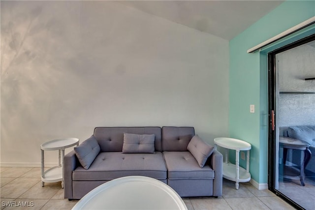 3914 SW 8th Ct Unit 103, Cape Coral, FL 33914 - tiled living room featuring baseboards