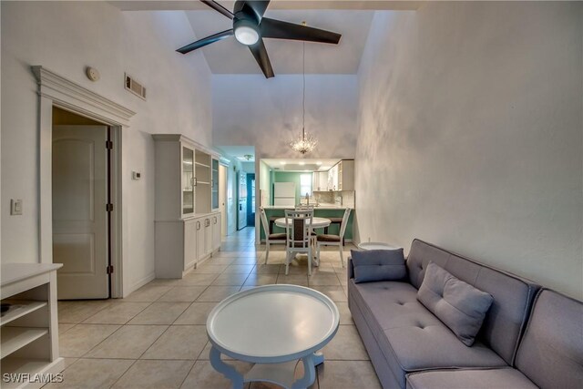 3914 SW 8th Ct Unit 103, Cape Coral, FL 33914 - living room featuring high vaulted ceiling, light tile patterned floors, ceiling fan, and a chandelier