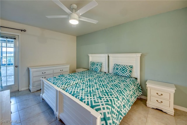 3914 SW 8th Ct Unit 103, Cape Coral, FL 33914 - bedroom featuring light tile patterned floors, baseboards, a ceiling fan, and access to outside