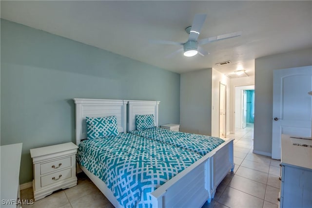 3914 SW 8th Ct Unit 103, Cape Coral, FL 33914 - bedroom with light tile patterned floors, baseboards, and a ceiling fan