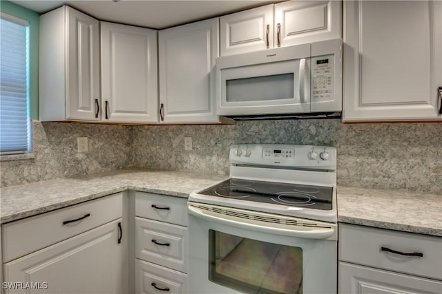 3914 SW 8th Ct Unit 103, Cape Coral, FL 33914 - kitchen featuring white appliances, white cabinetry, light countertops, and decorative backsplash