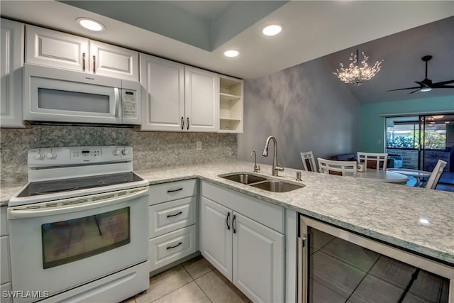 3914 SW 8th Ct Unit 103, Cape Coral, FL 33914 - kitchen featuring white appliances, a sink, wine cooler, recessed lighting, and white cabinetry