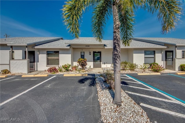 3914 SW 8th Ct Unit 103, Cape Coral, FL 33914 - view of building exterior featuring uncovered parking