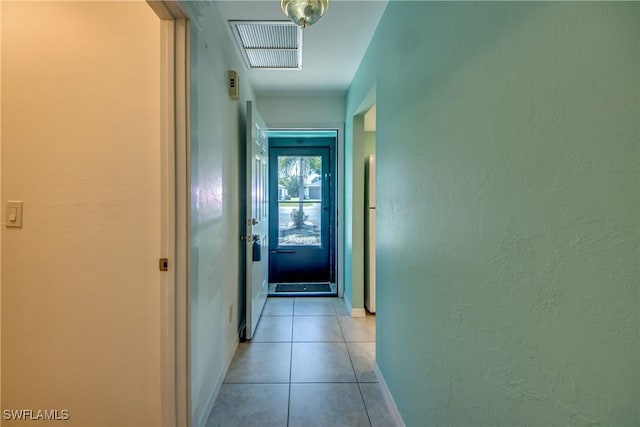 3914 SW 8th Ct Unit 103, Cape Coral, FL 33914 - hallway with light tile patterned floors, baseboards, and a textured wall