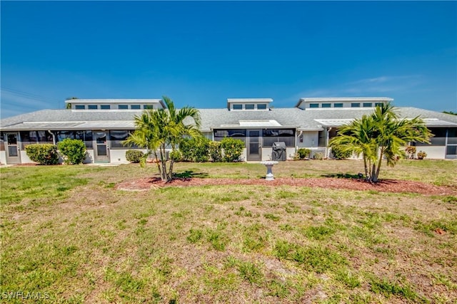 3914 SW 8th Ct Unit 103, Cape Coral, FL 33914 - rear view of house featuring a sunroom and a yard