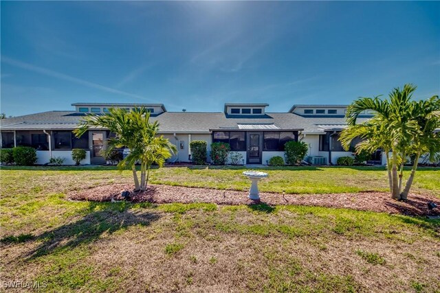 3914 SW 8th Ct Unit 103, Cape Coral, FL 33914 - view of front of home with a sunroom, a front lawn, and central air condition unit