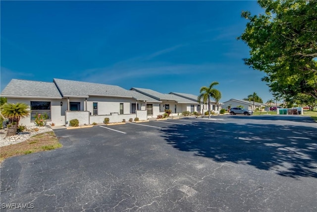 3914 SW 8th Ct Unit 103, Cape Coral, FL 33914 - view of front of house with uncovered parking and a residential view