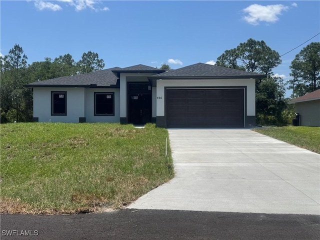 760 Fullerton Ave S, Lehigh Acres, FL 33974 - prairie-style house with stucco siding, an attached garage, driveway, and a front yard