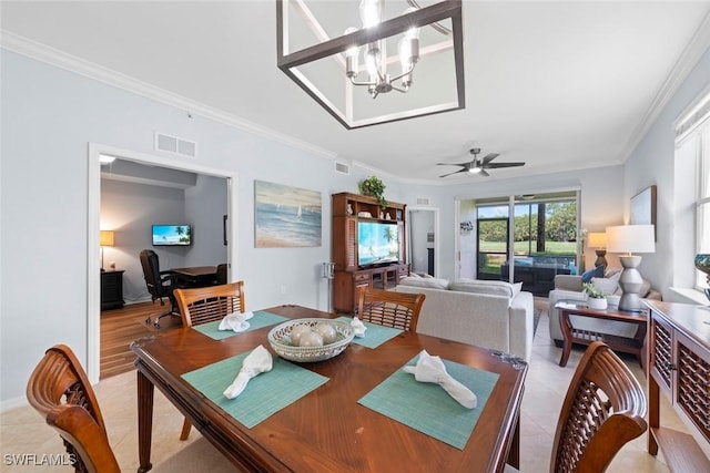 10317 Heritage Bay Blvd Unit 1418, Naples, FL 34120 - dining area with crown molding, a chandelier, light tile patterned floors, and a ceiling fan