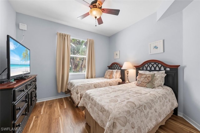10317 Heritage Bay Blvd Unit 1418, Naples, FL 34120 - bedroom featuring light wood-style flooring, baseboards, and ceiling fan