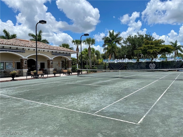 10317 Heritage Bay Blvd Unit 1418, Naples, FL 34120 - view of tennis court with fence