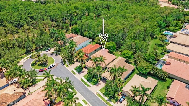 7874 Bucks Run Dr, Naples, FL 34120 - aerial perspective of suburban area featuring a heavily wooded area
