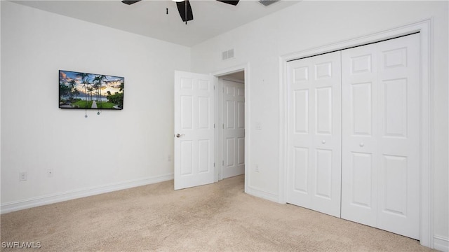 7874 Bucks Run Dr, Naples, FL 34120 - unfurnished bedroom with light carpet, a closet, a ceiling fan, and baseboards