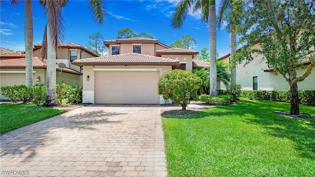7874 Bucks Run Dr, Naples, FL 34120 - mediterranean / spanish-style house with stucco siding, a tile roof, decorative driveway, a garage, and a front lawn