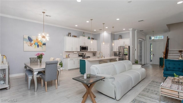 7874 Bucks Run Dr, Naples, FL 34120 - living room featuring light wood-style flooring, recessed lighting, crown molding, baseboards, and stairs