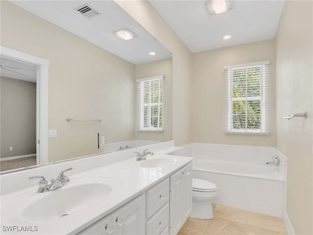 15329 Laughing Gull Ln, Bonita Springs, FL 34135 - bathroom with a bath, double vanity, and recessed lighting