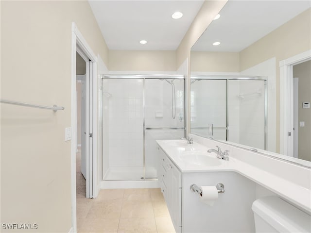 15329 Laughing Gull Ln, Bonita Springs, FL 34135 - bathroom featuring tile patterned flooring, a shower stall, double vanity, and recessed lighting