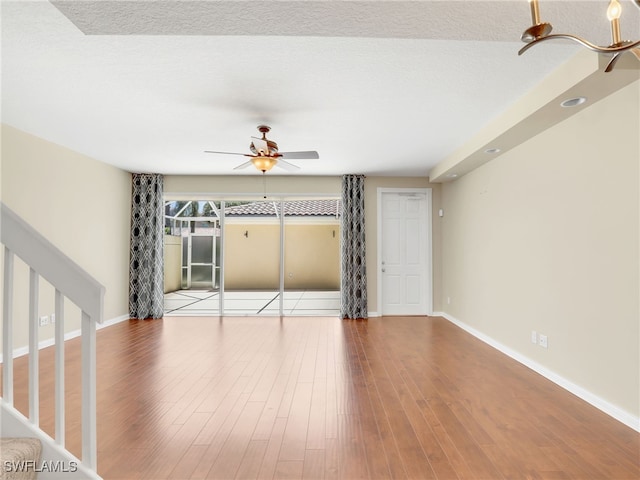 15329 Laughing Gull Ln, Bonita Springs, FL 34135 - unfurnished living room with ceiling fan and wood finished floors
