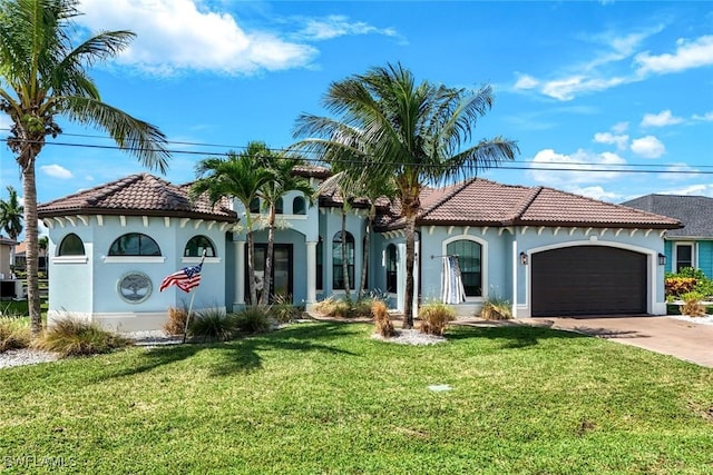 208 SW 15th St, Cape Coral, FL 33991 - mediterranean / spanish-style home featuring stucco siding, driveway, a front lawn, an attached garage, and a tile roof