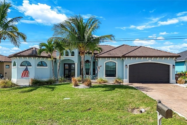 208 SW 15th St, Cape Coral, FL 33991 - mediterranean / spanish home with french doors, a tile roof, driveway, a garage, and stucco siding