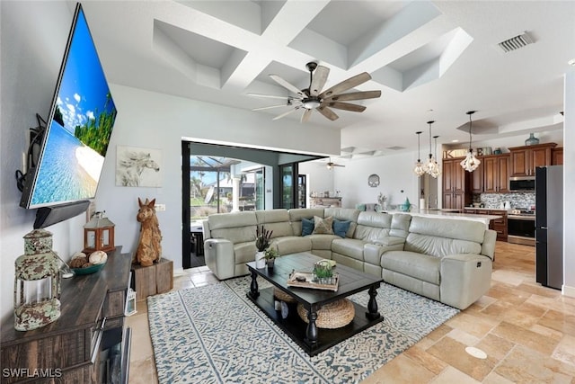 208 SW 15th St, Cape Coral, FL 33991 - living area featuring coffered ceiling, ceiling fan, beam ceiling, and a chandelier