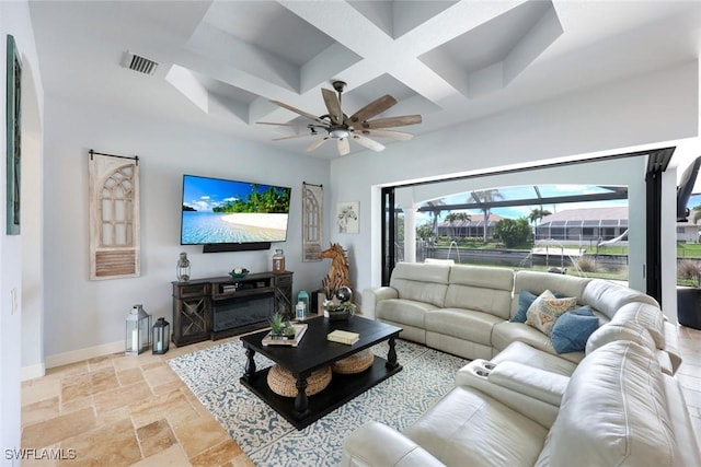 208 SW 15th St, Cape Coral, FL 33991 - living area with coffered ceiling, stone tile flooring, baseboards, ceiling fan, and beam ceiling