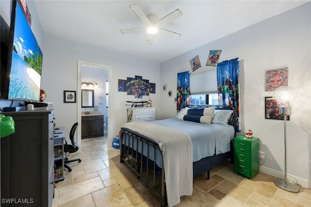 208 SW 15th St, Cape Coral, FL 33991 - bedroom with stone tile floors, connected bathroom, and a ceiling fan