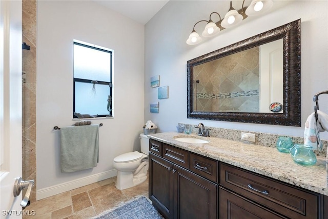 208 SW 15th St, Cape Coral, FL 33991 - full bath featuring vanity, baseboards, toilet, tiled shower, and stone finish floors