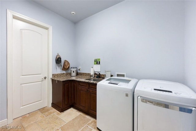 208 SW 15th St, Cape Coral, FL 33991 - laundry room featuring independent washer and dryer, stone tile floors, and cabinet space