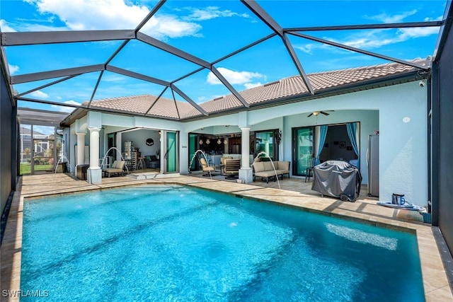 208 SW 15th St, Cape Coral, FL 33991 - outdoor pool featuring ceiling fan, an outdoor living space, a patio, area for grilling, and a lanai