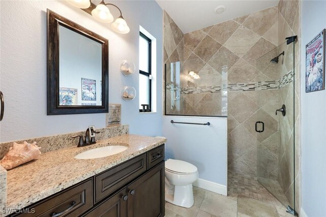 208 SW 15th St, Cape Coral, FL 33991 - bathroom with vanity, toilet, and a stall shower