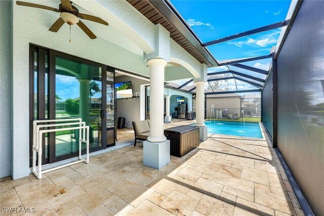 208 SW 15th St, Cape Coral, FL 33991 - outdoor pool with ceiling fan, a patio, and glass enclosure