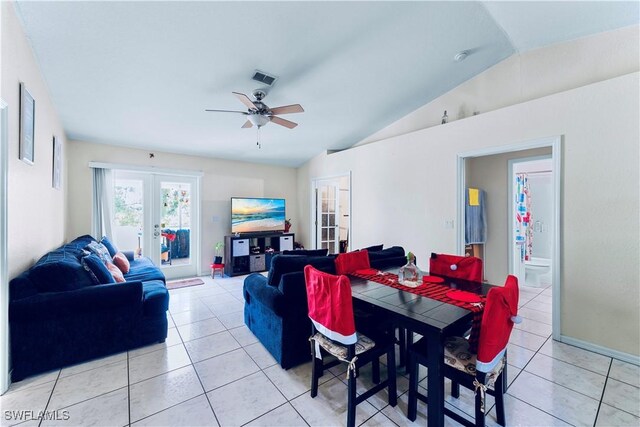 869/871 Eisenhower Blvd, Lehigh Acres, FL 33974 - dining room with french doors, vaulted ceiling, light tile patterned floors, and a ceiling fan