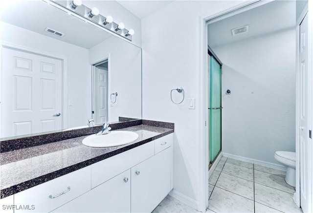 869/871 Eisenhower Blvd, Lehigh Acres, FL 33974 - bathroom featuring a stall shower, vanity, toilet, and baseboards