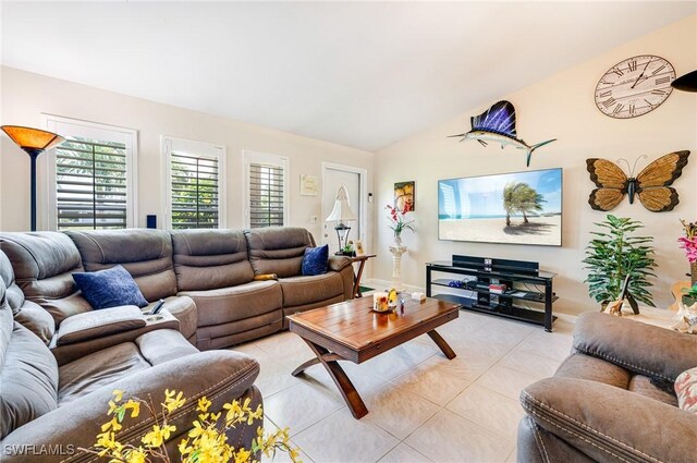 2912 SW 1st Ter, Cape Coral, FL 33991 - living area featuring vaulted ceiling and light tile patterned floors