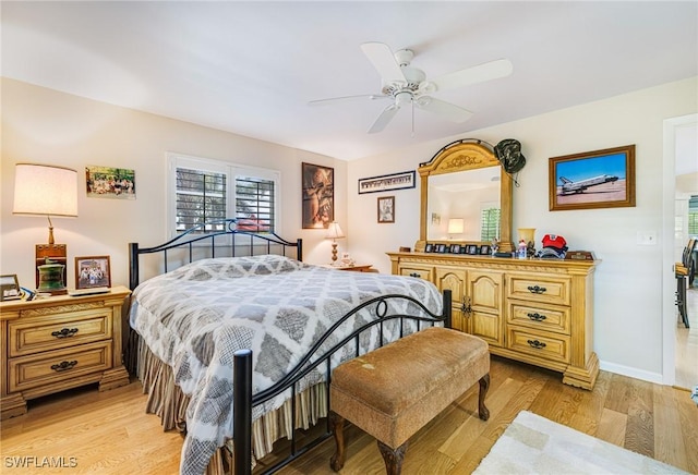 2912 SW 1st Ter, Cape Coral, FL 33991 - bedroom featuring light wood-style floors, ceiling fan, and baseboards
